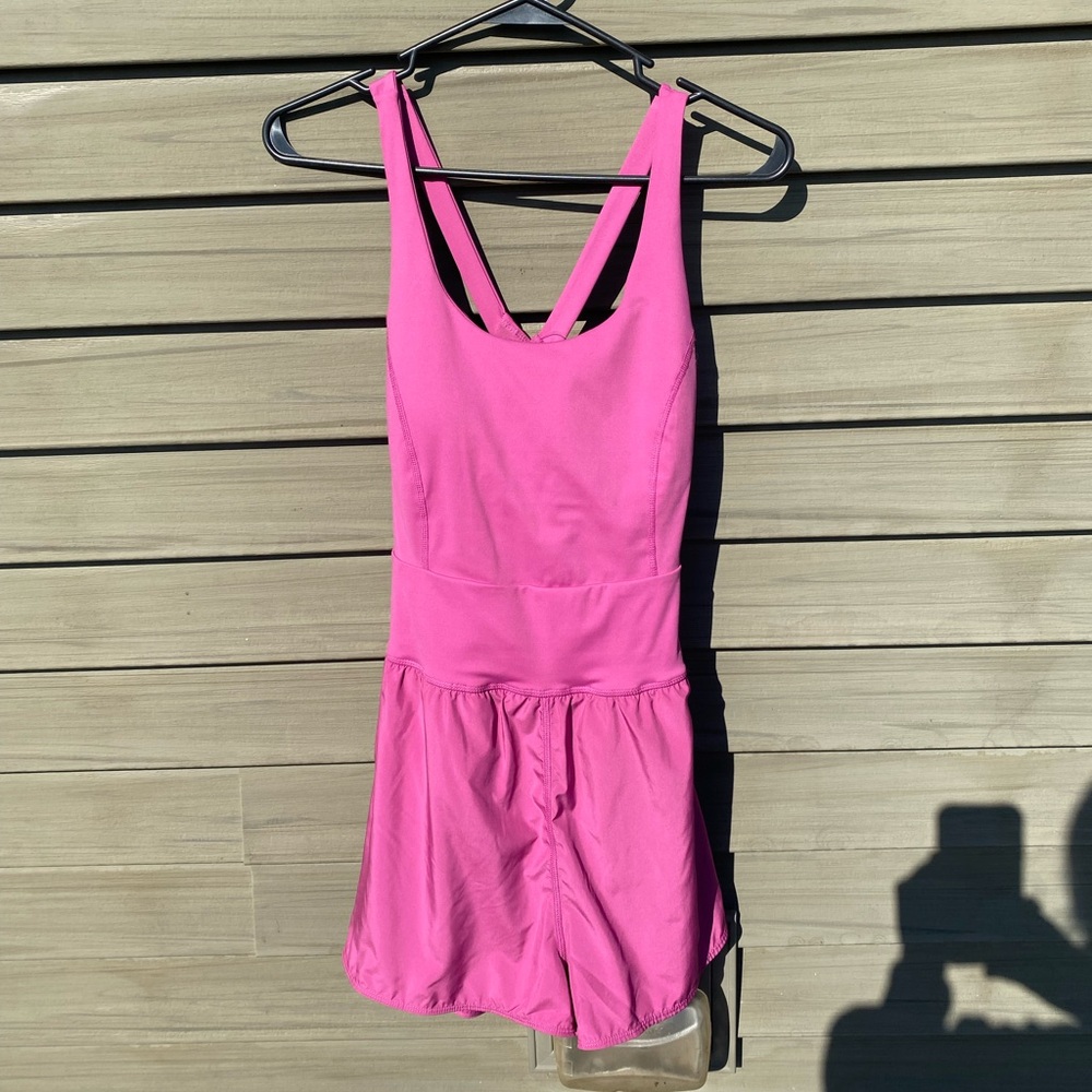 Avia strappy buttersoft athletic romper in color meadow mauve.